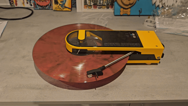 Gif of our burger record player playing the Fair Youth album by Maybeshewill.