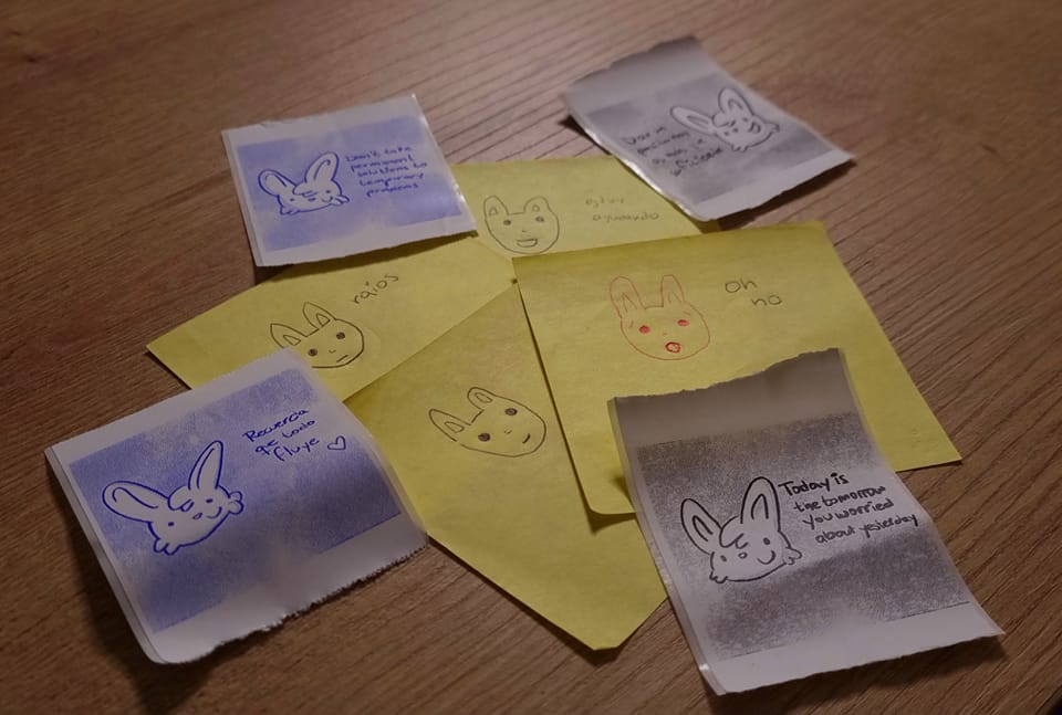 Image of post it notes with the first bunnies I draw mixed with thermic prints of more recent bunnies